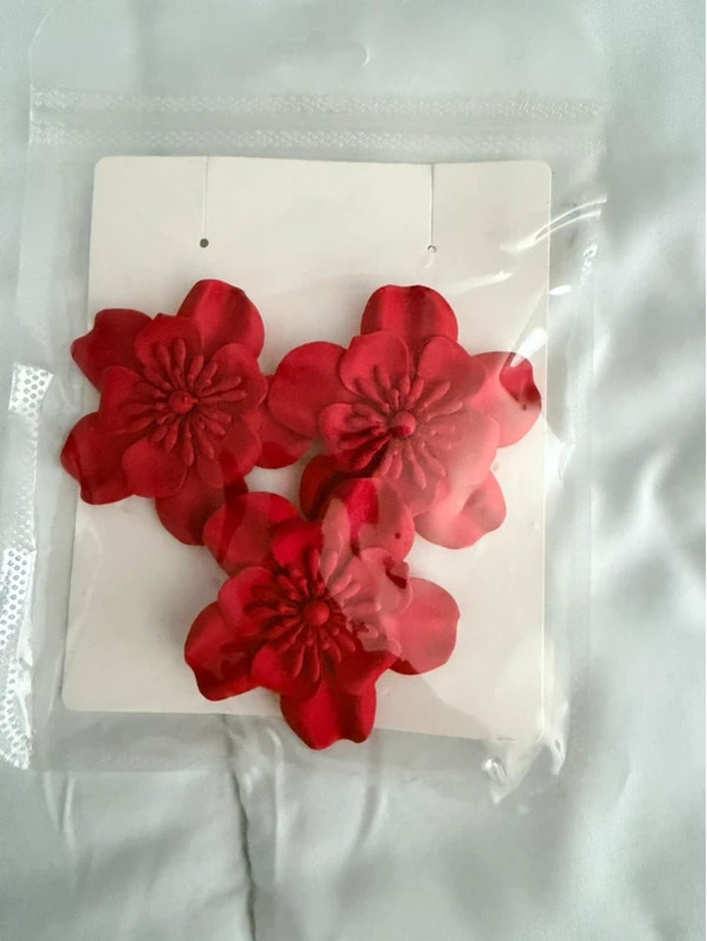 Red floral earrings with three red flower shapes #floral